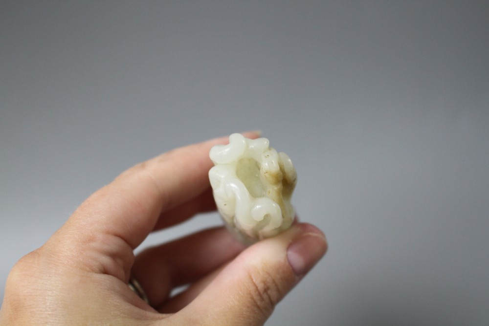 A Chinese jade carving of a finger citron, length 5.5cm, width 2.5cm, depth 2cm